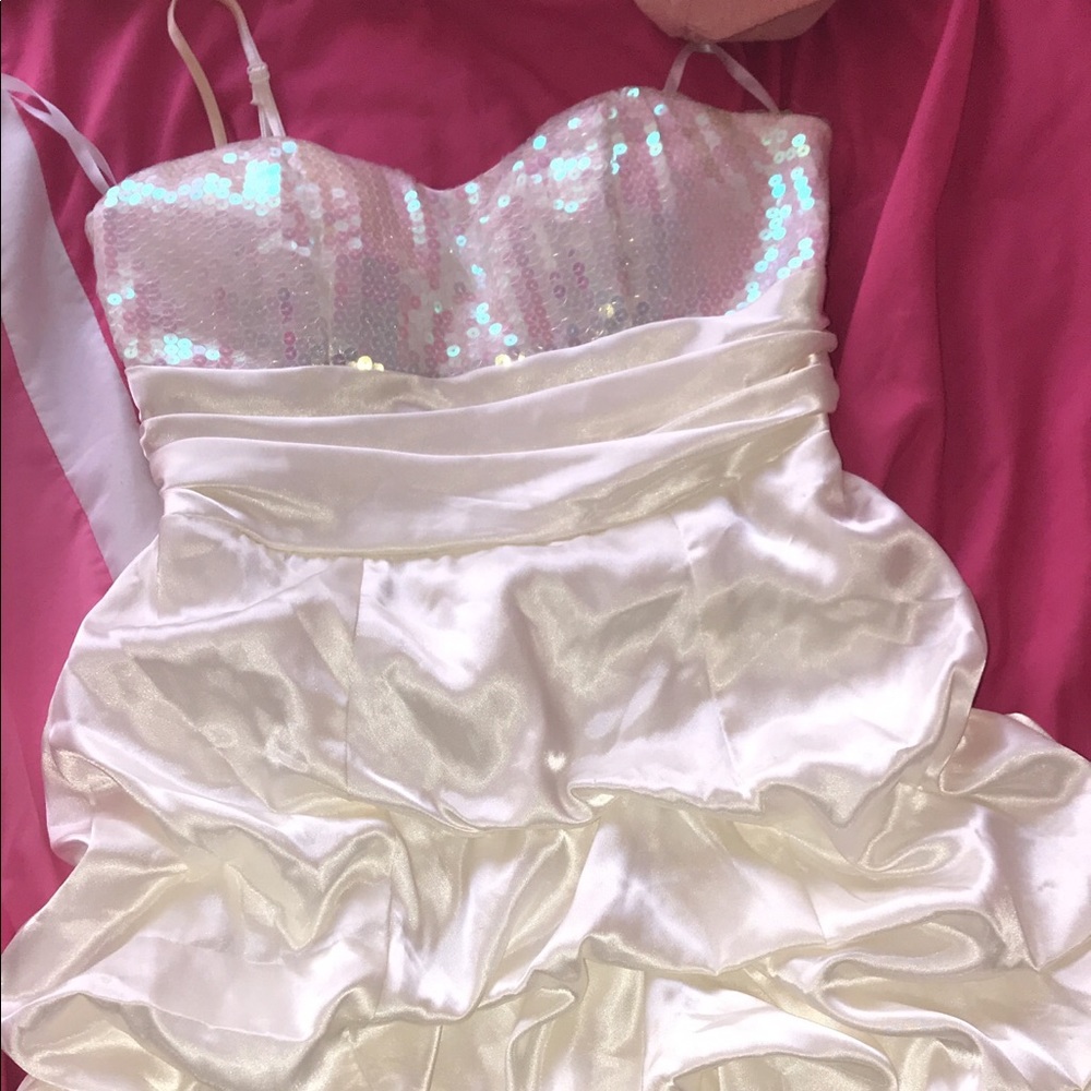 A  White/cream homecoming dress with a sparkly top